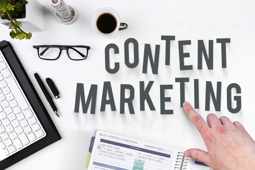 content marketing workspace featuring large content marketing text on a white desk